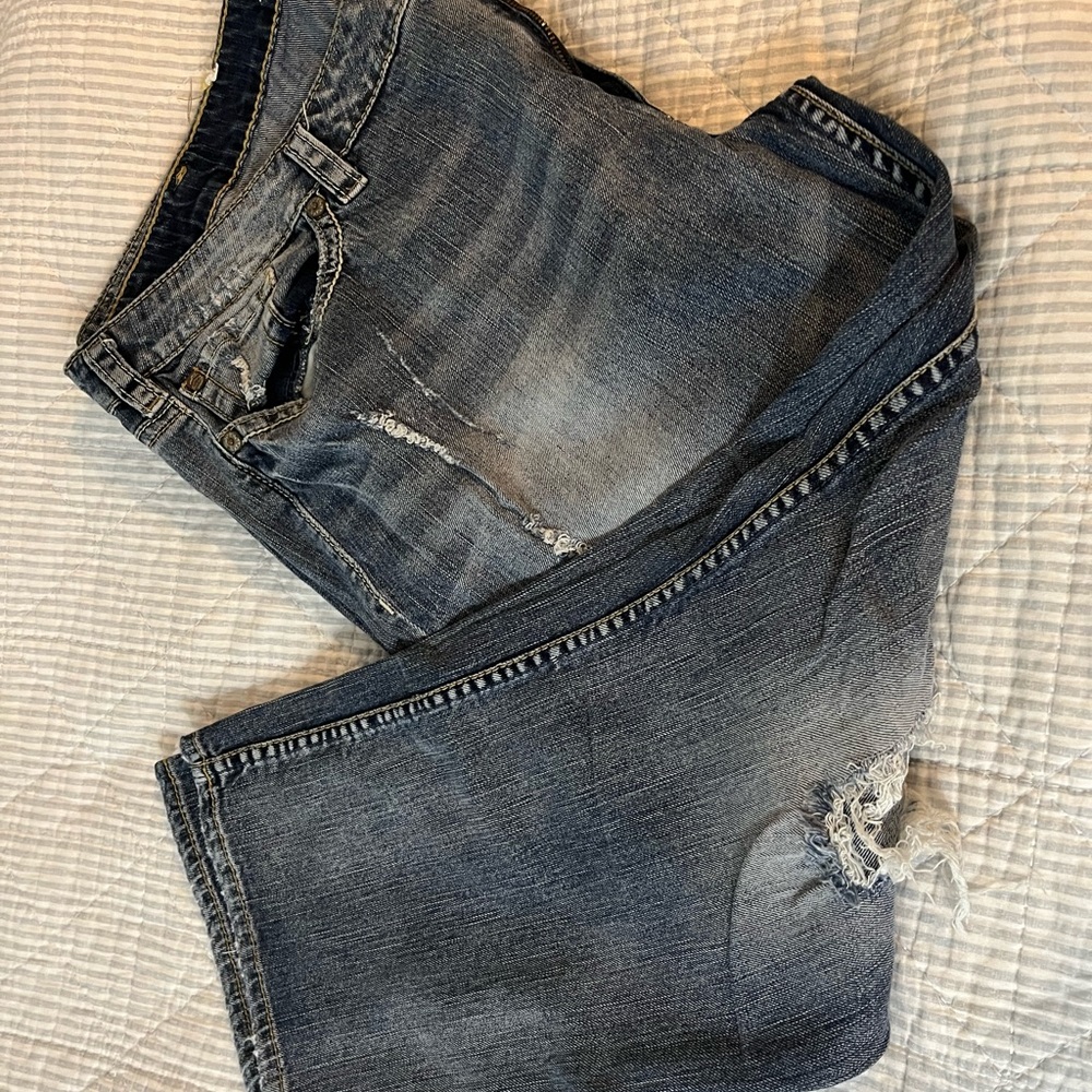 Distressed silver jeans